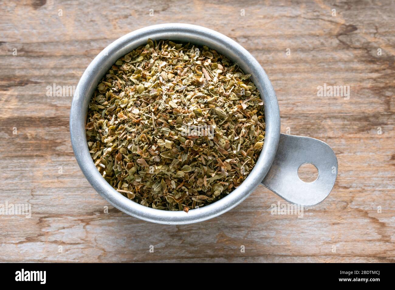 Dried Oregano in a Measuring Cup Stock Photo Alamy