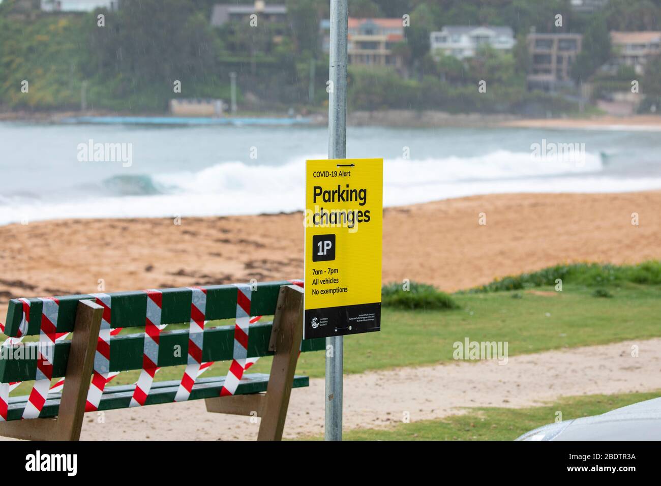 Sydney, Australia. Friday  10th April 2020. Government officials have been insisting that people stay at home this Easter weekend and not to make any unnecessary journeys, rain falling on Sydney will have discouraged many from venturing out and the beaches are indeed quiet, but surfers and people exercising could be seen at Palm Beach in Sydney early on Good Friday. The local council has also restricted car parking to 1 hour to discourage people from driving to the beaches. Credit Martin Berry/Alamy Live News Stock Photo