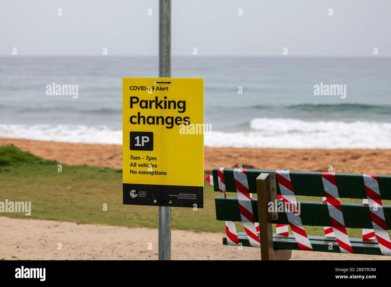 Sydney, Australia. Friday  10th April 2020. Government officials have been insisting that people stay at home this Easter weekend and not to make any unnecessary journeys, rain falling on Sydney will have discouraged many from venturing out and the beaches are indeed quiet, but surfers and people exercising could be seen at Palm Beach in Sydney early on Good Friday. The local council has also restricted car parking to 1 hour to discourage people from driving to the beaches. Credit Martin Berry/Alamy Live News Stock Photo