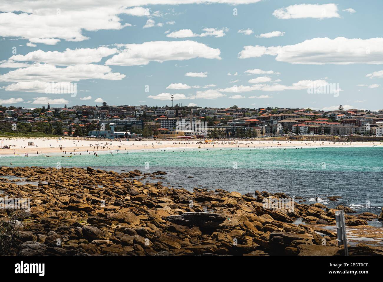 People enjoying Maroubra Beach on a bright summers day, as seen from the start of the Malabar Headland National Park Coastal Walk. Stock Photo