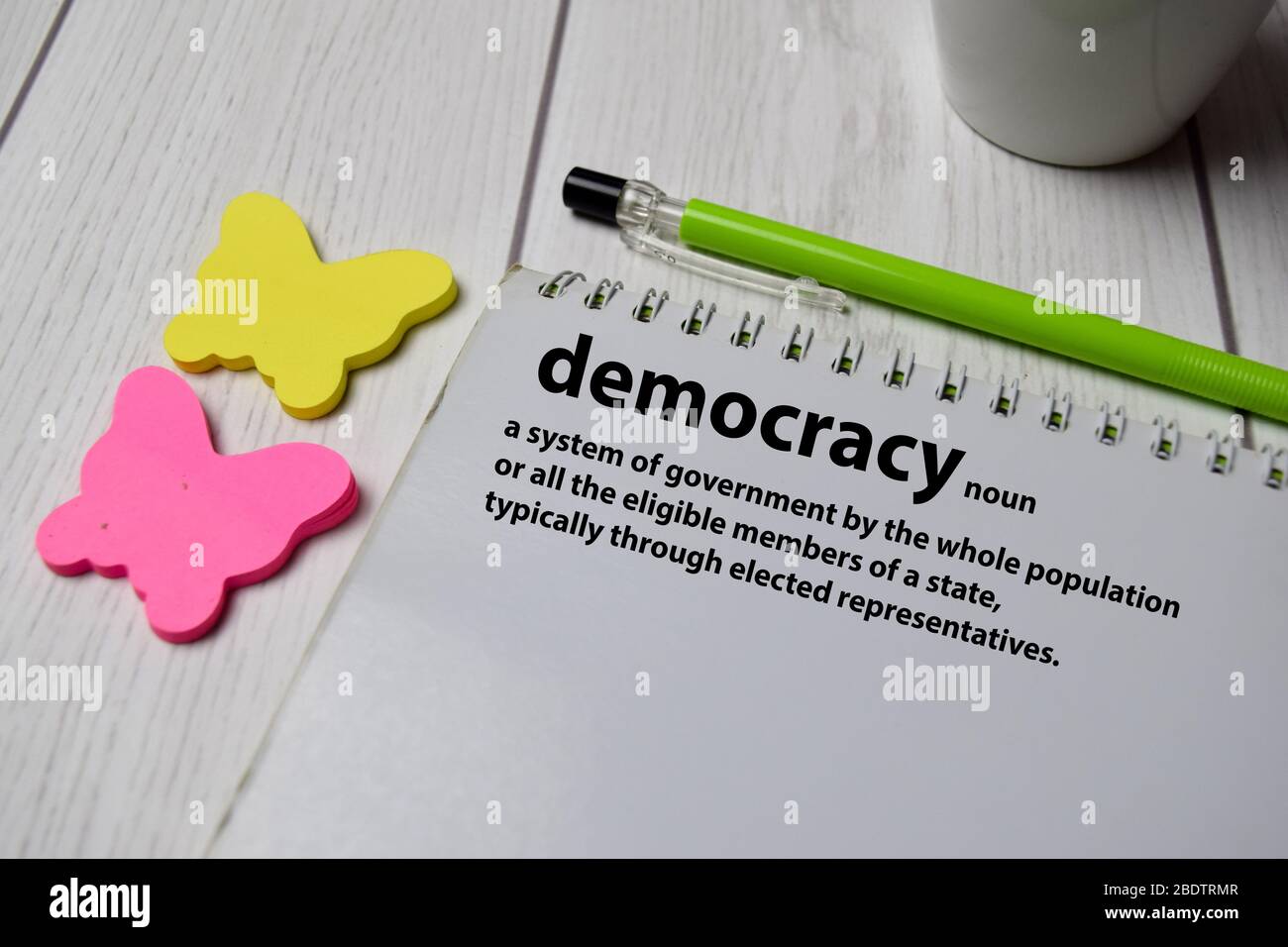 Definition of Democracy word with a meaning on a book. dictionary