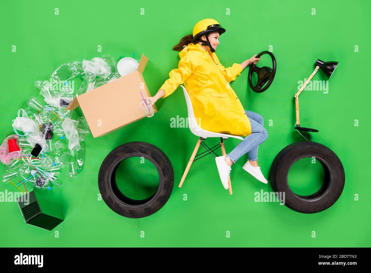 Full length high angle above flat lay photo of irresponsible lady drive motor bike throwing garbage cup plastic products falling road littering nature Stock Photo