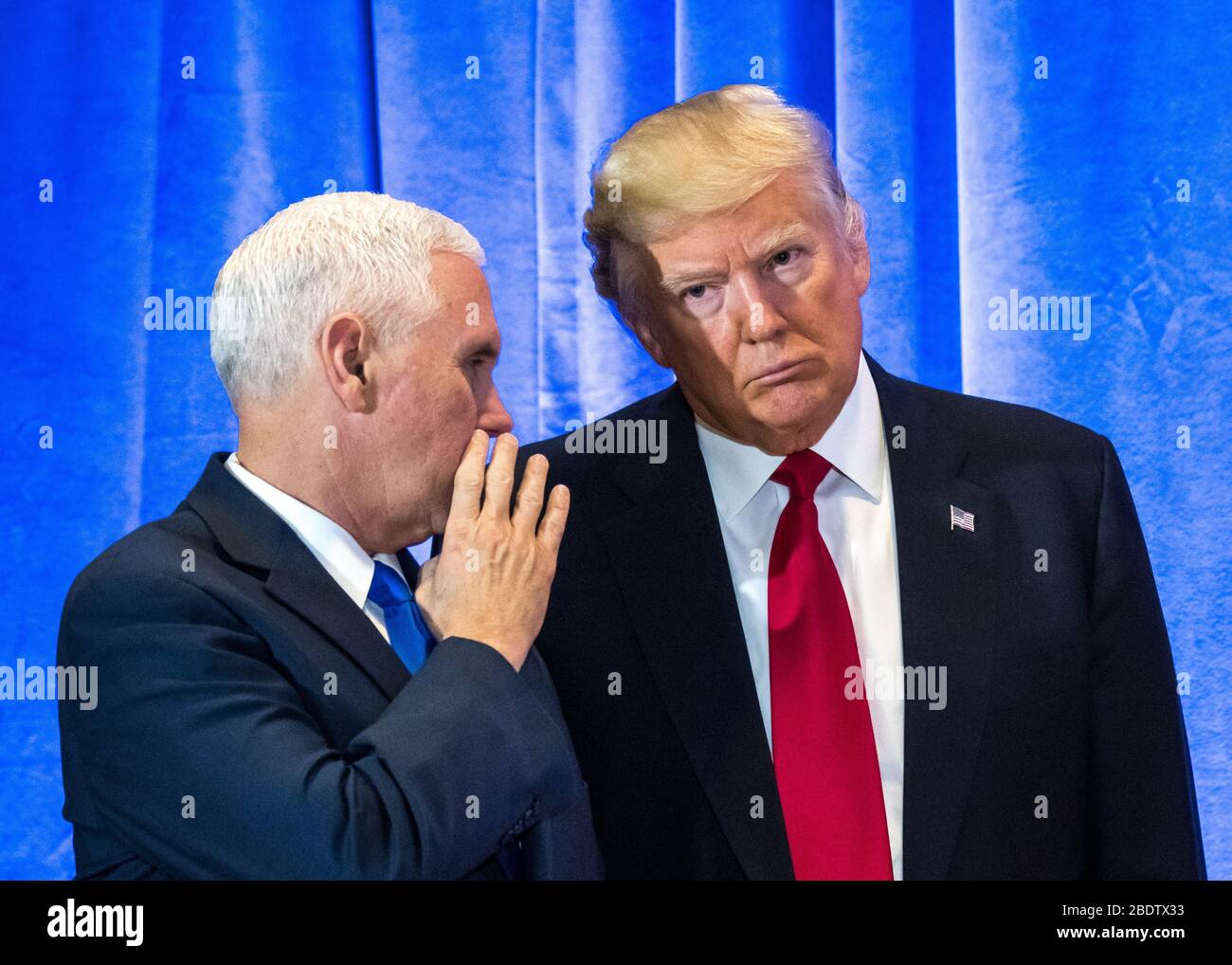 New York, USA, 11 Jan 2016 - US President-elect Donald Trump (R) listens to Vice-President-elect Mike Pence in New York on January 11, 2016,  at a new Stock Photo