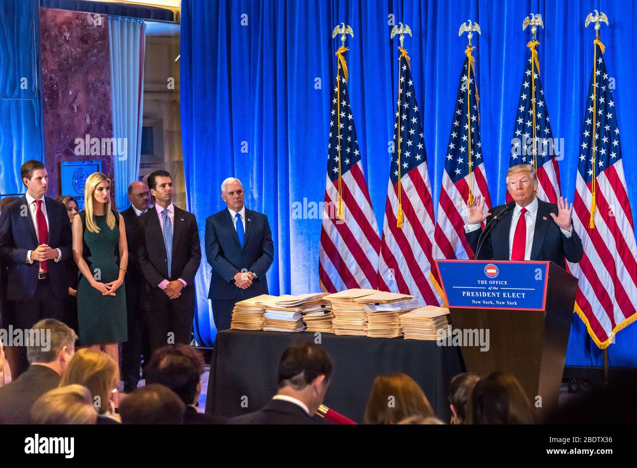New York, USA, 11 Jan 2017 - US President-elect Donald Trump addresses a press conference watched by (L-R): his son Eric, daughter Ivanka, Allen Weiss Stock Photo