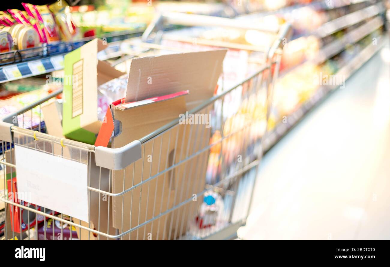 Empty carton in the stainless trolley at Supermarket aisle preparing