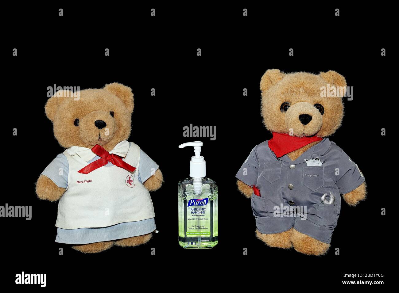 Teddy Bears with Hand Sanitiser - clean your hands and protect your loved ones. Stock Photo