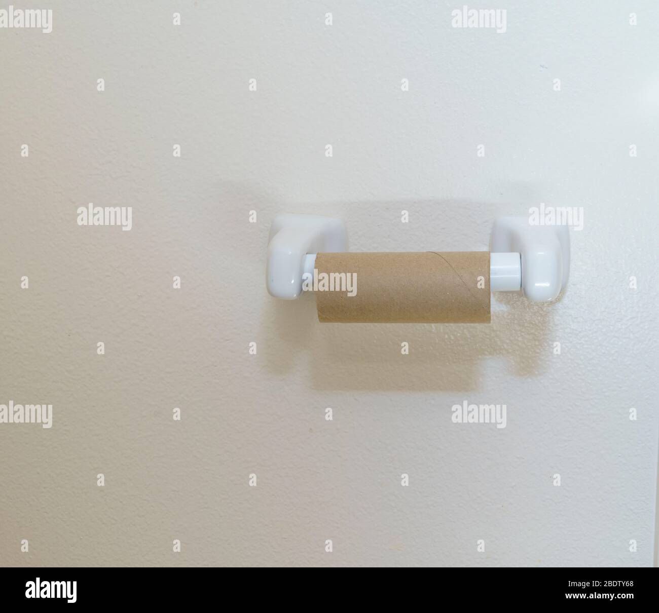 toilet paper roll on wall dispenser Stock Photo Alamy
