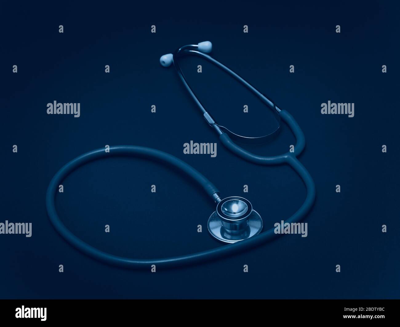 Stethoscope - a medical instrument for listening to the action of someone's heart or breathing, typically having a small disc-shaped resonator that is Stock Photo