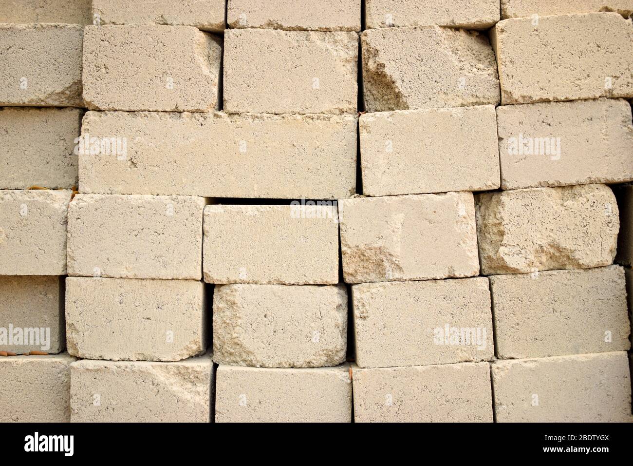 Concrete Cement Block bricks in stack for wall construction. Dirty Old Texture Stock Photo