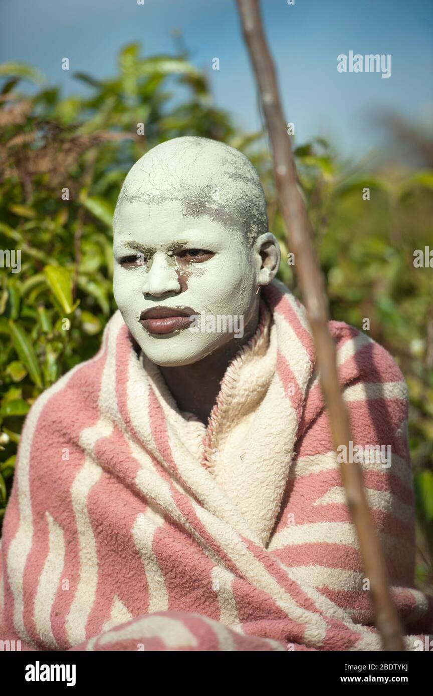 AmaPondo Xhosa boy with white clay, I-Futa, on face who have just been circumcised, uku-Lukwa, Umzimvubu Valley, Mkanzeni, Pondoland, Eastern Cape Stock Photo