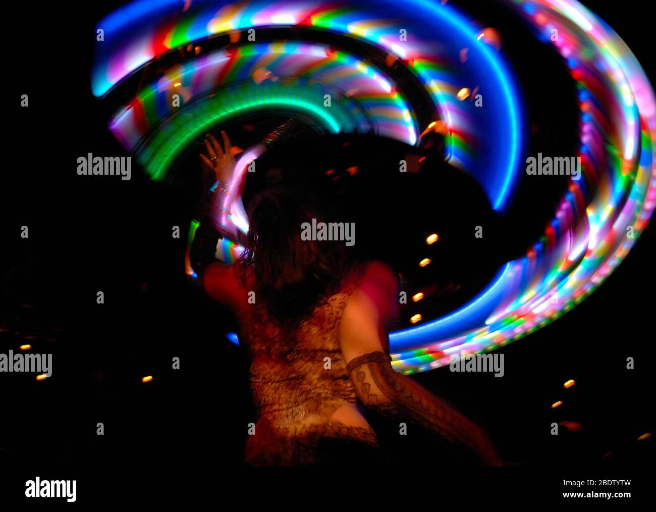Multi Coloured Hula Hoop Lights Twirled in Circular Motion by Dancer in  Lace with Slow Shutter Speed Causing Intentional Blur Photography Stock  Photo - Alamy
