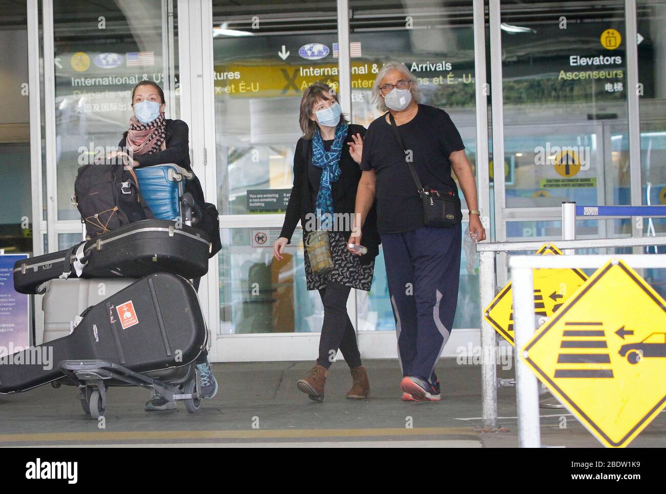 Vancouver, Canada. 9th Apr, 2020. Travellers are seen at the exit of the arrival hall at Vancouver International Airport in Richmond, Canada, April 9, 2020. Credit: Liang Sen/Xinhua/Alamy Live News Stock Photo