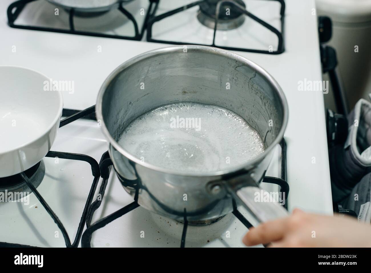 Boiling sugar mixture. Wet Caramelization. Making Golden Syrup Series Stock Photo Alamy