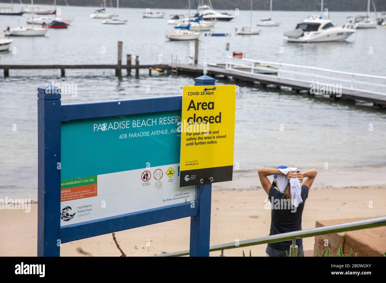 COVID 19 Sydney, local council has closed some beaches for the Easter Weekend including the small Paradise beach on Sydney's Pittwater Australia Stock Photo