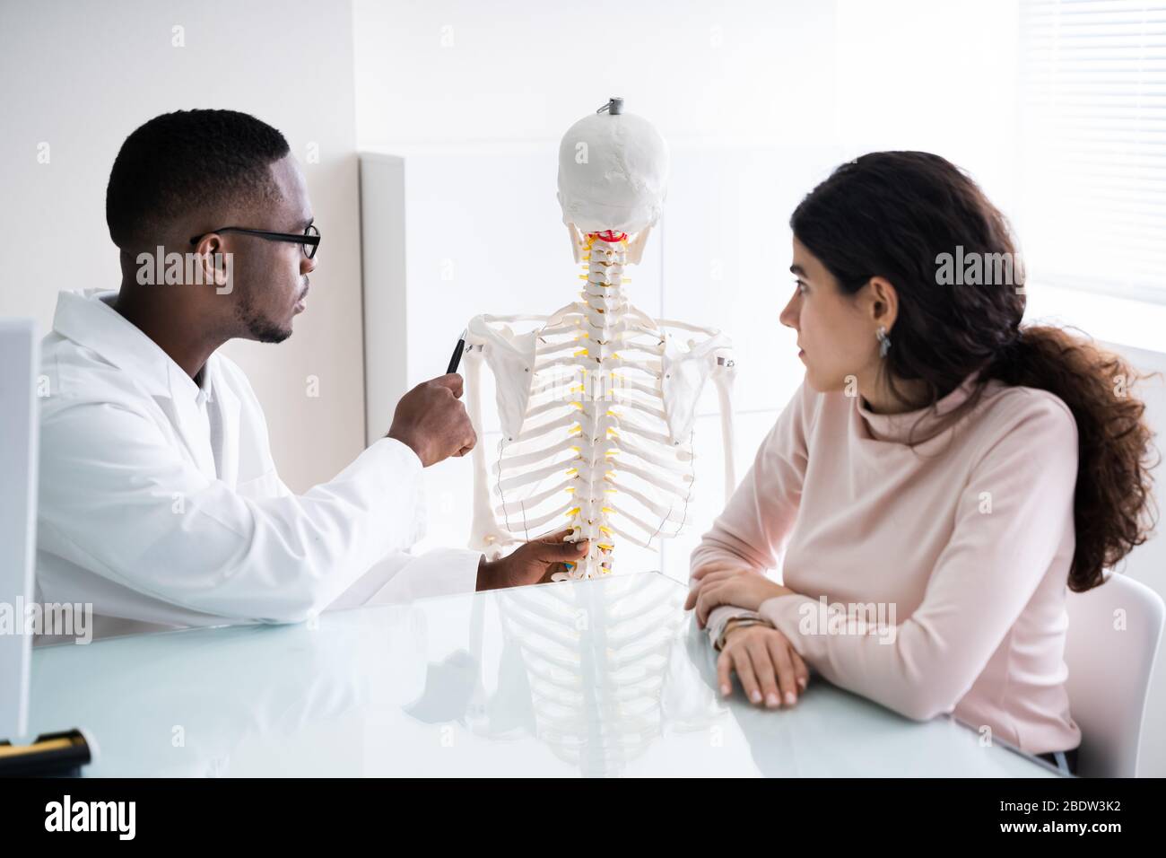 Chiropractor Doctor Consultation In Physiotherapy Clinic Or Hospital Stock Photo
