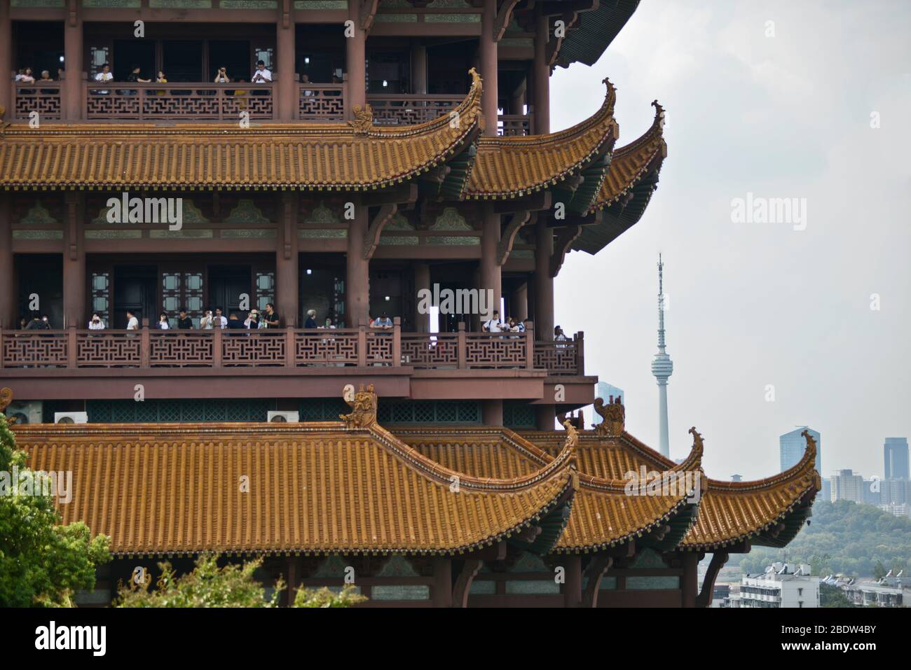 Yellow Crane Tower: details on the architecture with the TV Tower on the background. Wuhan, China Stock Photo