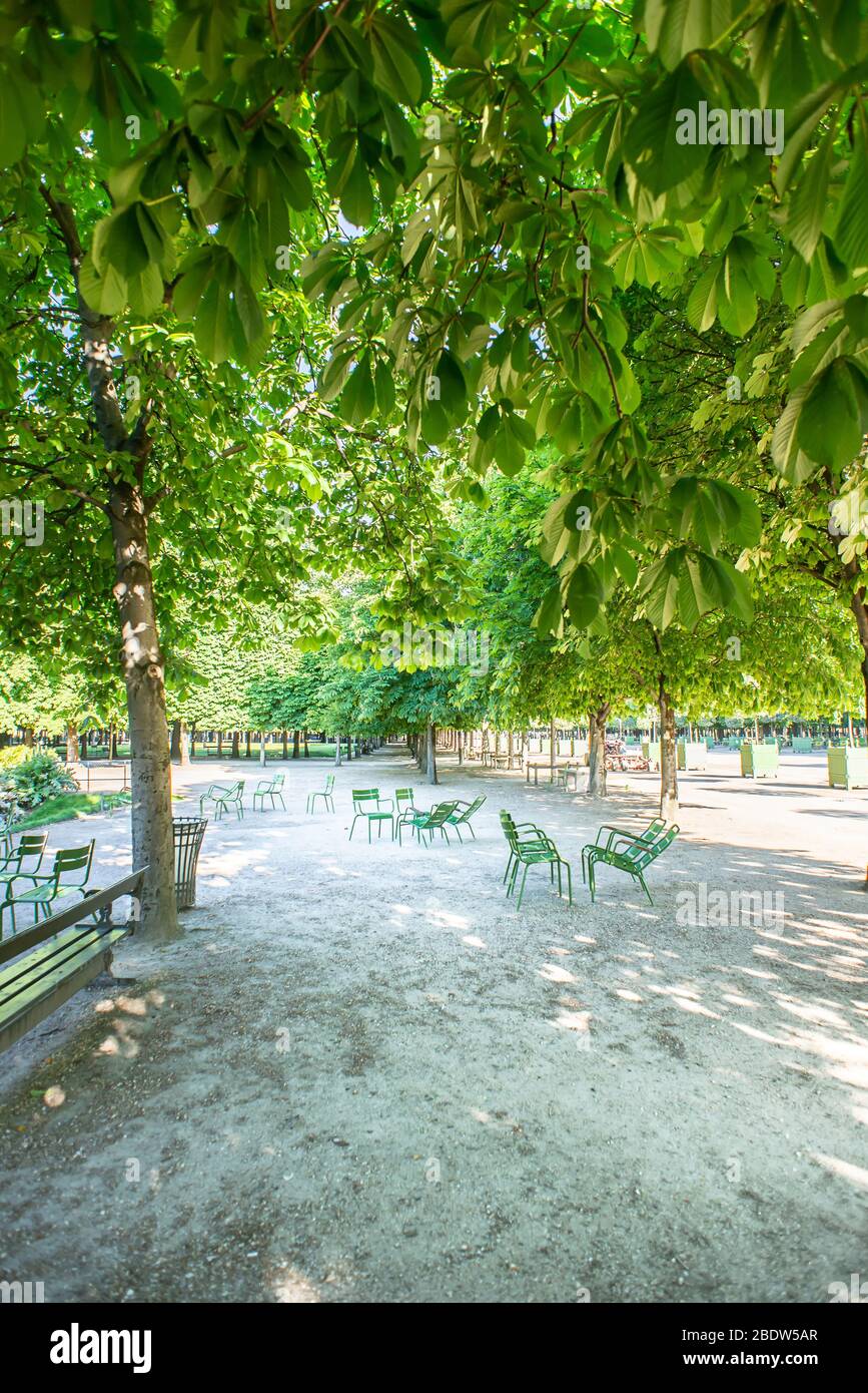 Tuileries Garden with Green Metal Chairs in a Sunny Spring Day in Paris. France. Stock Photo