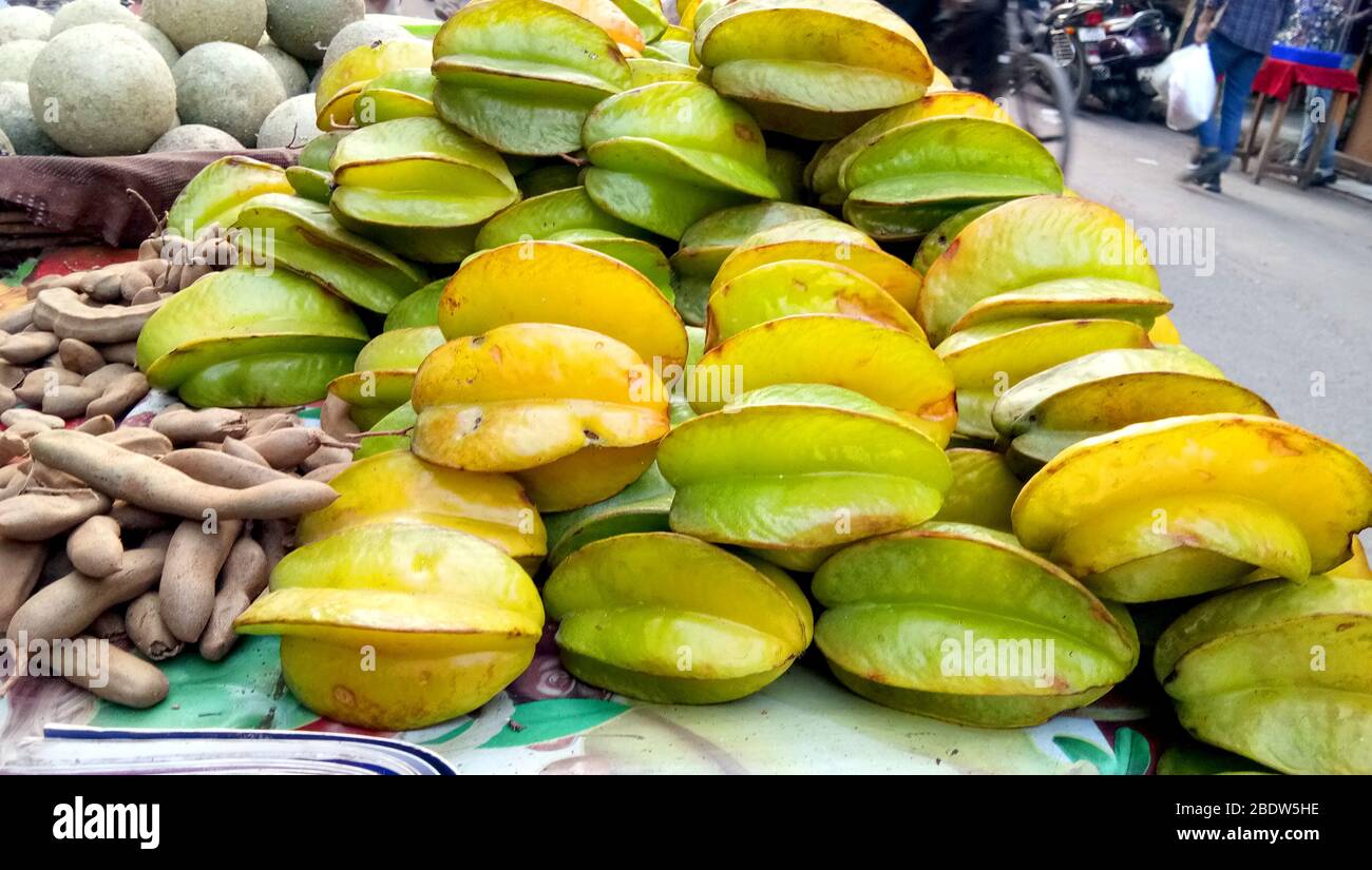 A bunch of star fruit or carambola to sell in local market. Green and yellow color give the unique deliciousness of this rare tropical fruit Stock Photo