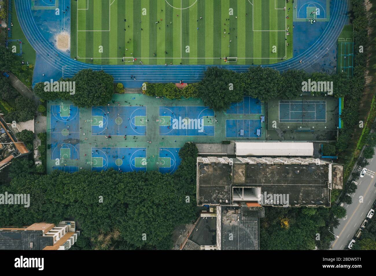 Aerial overhead drone shot of basketball and football field at middle school in Chongqing, China Stock Photo