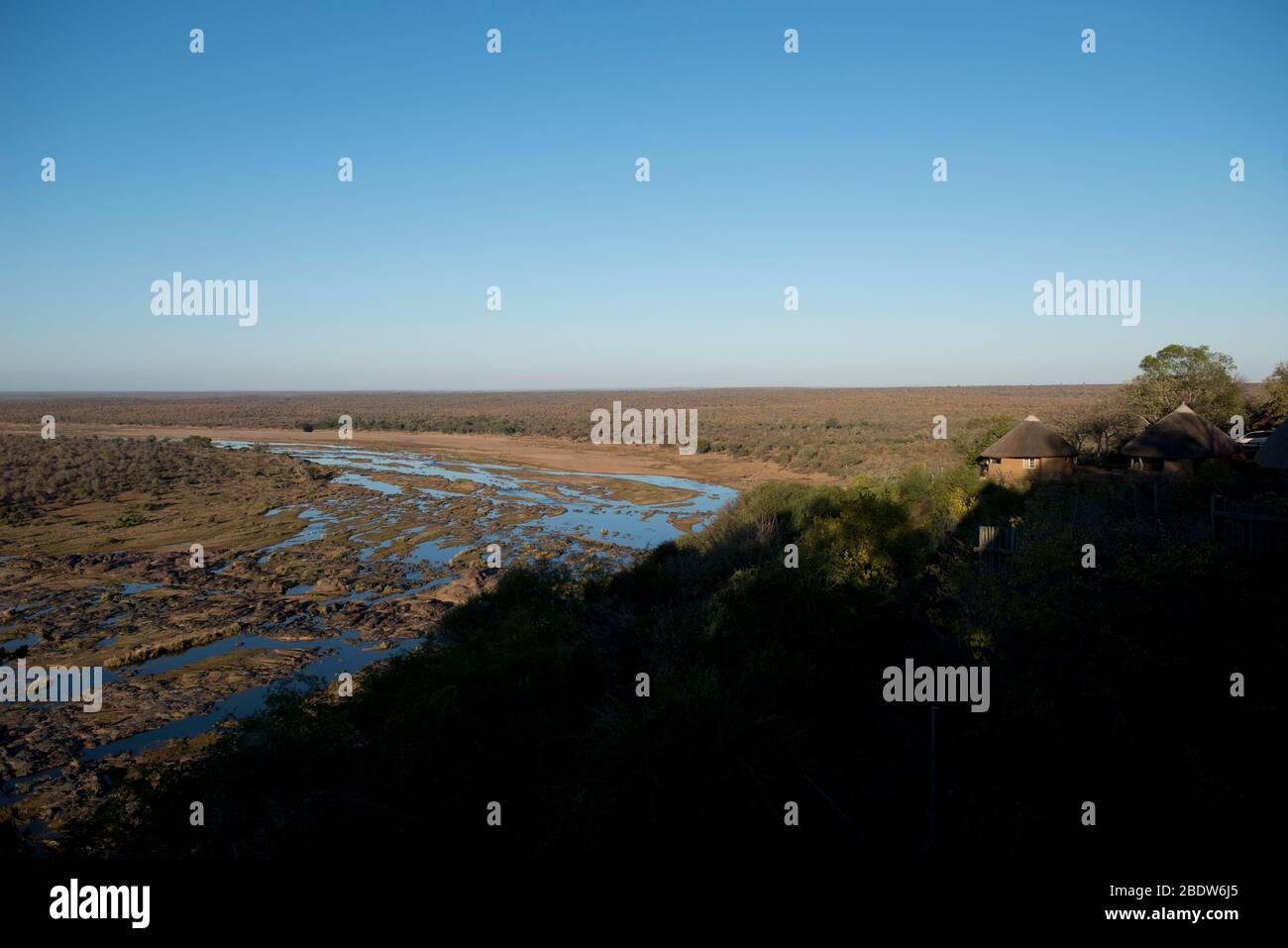 Olifants river view running through sandbanks with bungalow, Olifants Camp, Kruger National Park, Mpumalanga province, South Africa, Africa Stock Photo