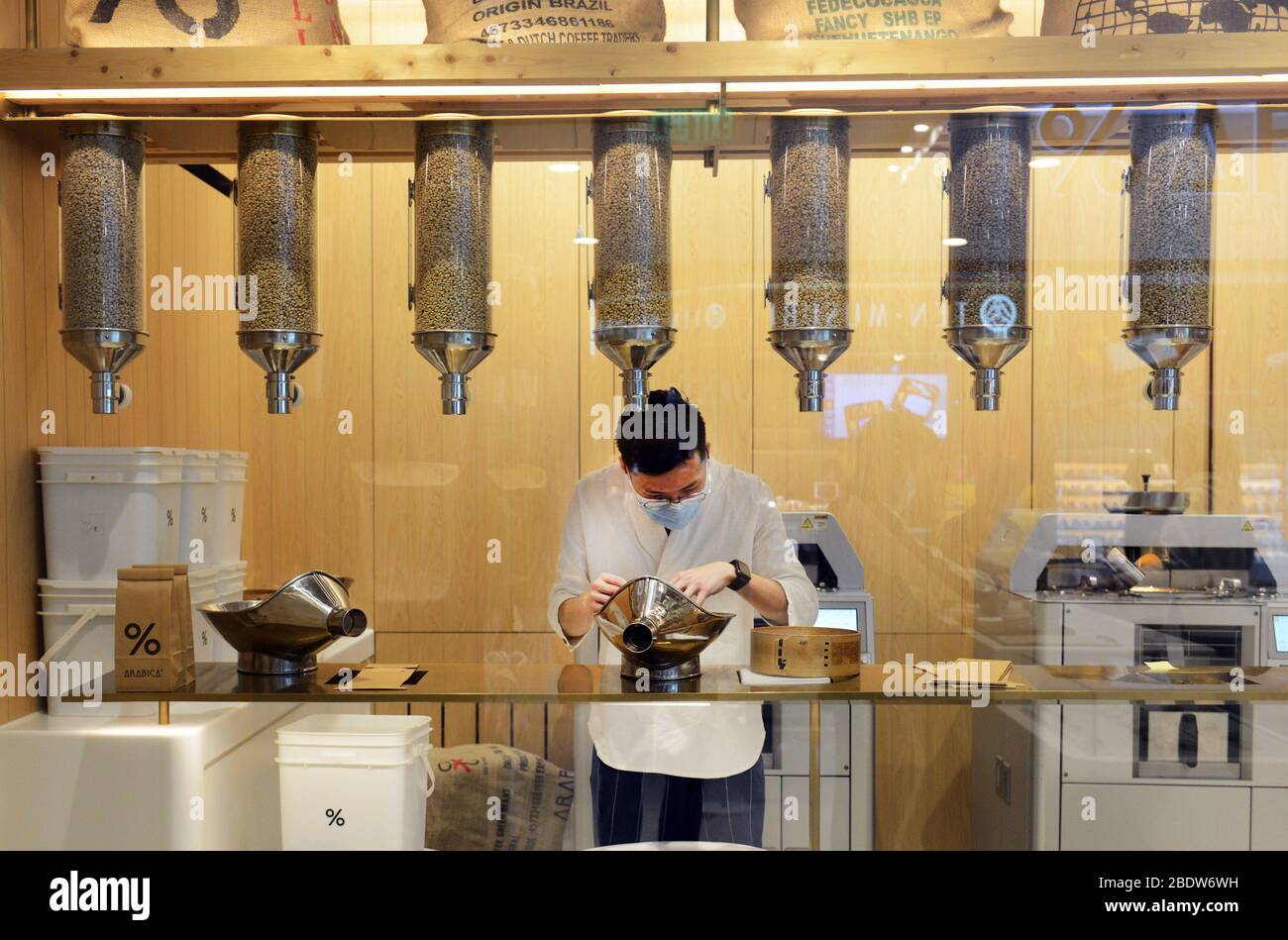 Sorting out coffee beans at the Arabica Hong Kong IFC Stock Photo Alamy