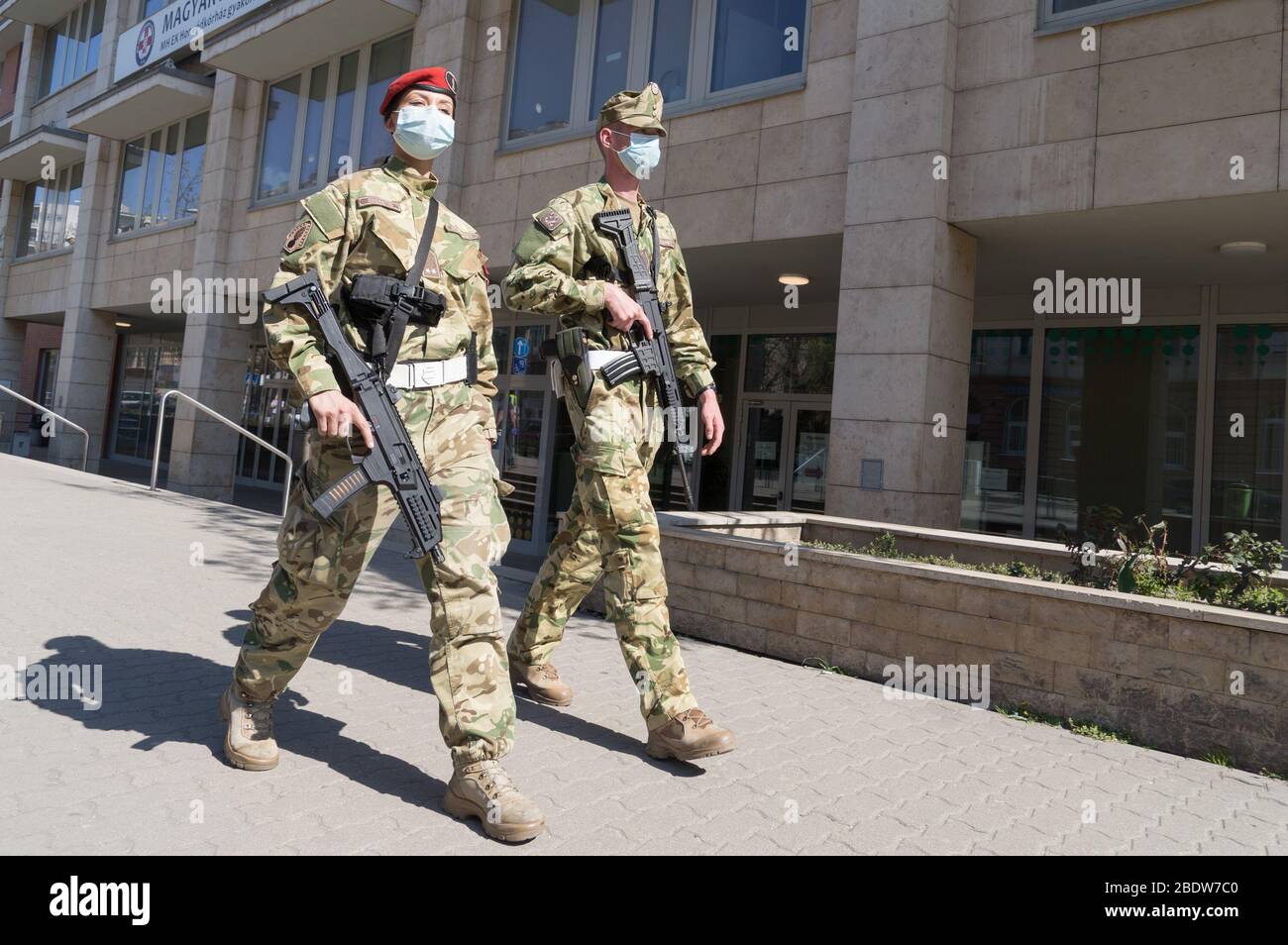 Budapest, Hungary. 9th Apr, 2020. Military personnel patrol along a street in Budapest, Hungary, on April 9, 2020. The Hungarian government will indefinitely extend the lockdown imposed nearly two weeks ago due to the coronavirus epidemic, Prime Minister Viktor Orban announced on his Facebook page on Thursday. According to official figures, the number of confirmed coronavirus cases in Hungary stood at 980 on Thursday, with 96 recoveries and 66 fatalities. Credit: Attila Volgyi/Xinhua/Alamy Live News Stock Photo