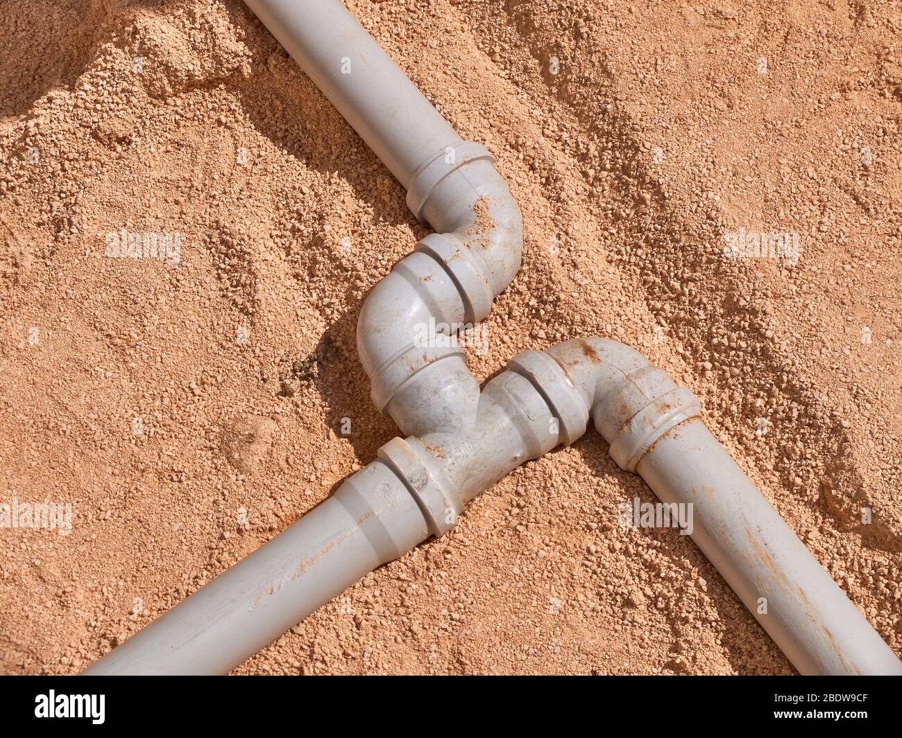 Junction of plastic sewer pipes. Sewage pipeline system of residential