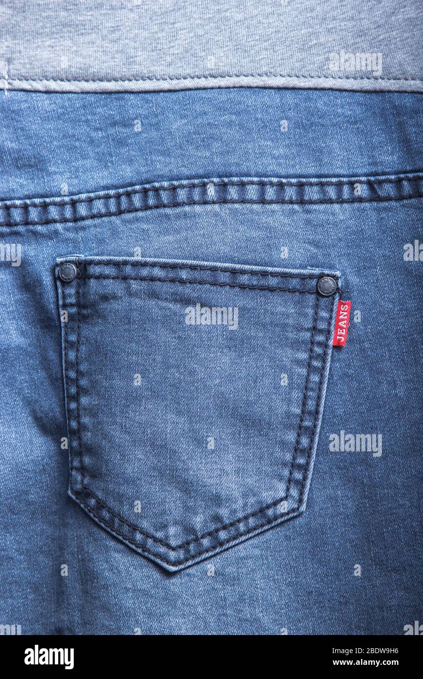 back pocket of denim trousers. with ripped denim jeans close up for  pregnant women Stock Photo - Alamy