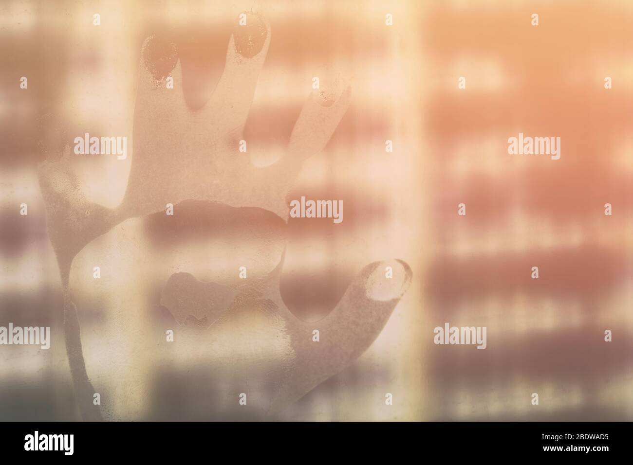 Silhouette of the hand on the window symbolizing the concept of anxiety