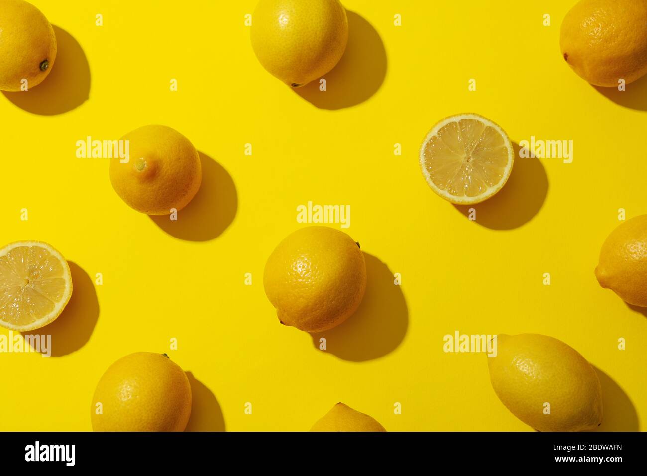 Flat lay composition with lemons on yellow background Stock Photo