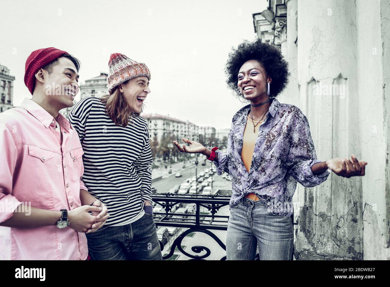 Cheerful mixed raced friends laughing at joke Stock Photo