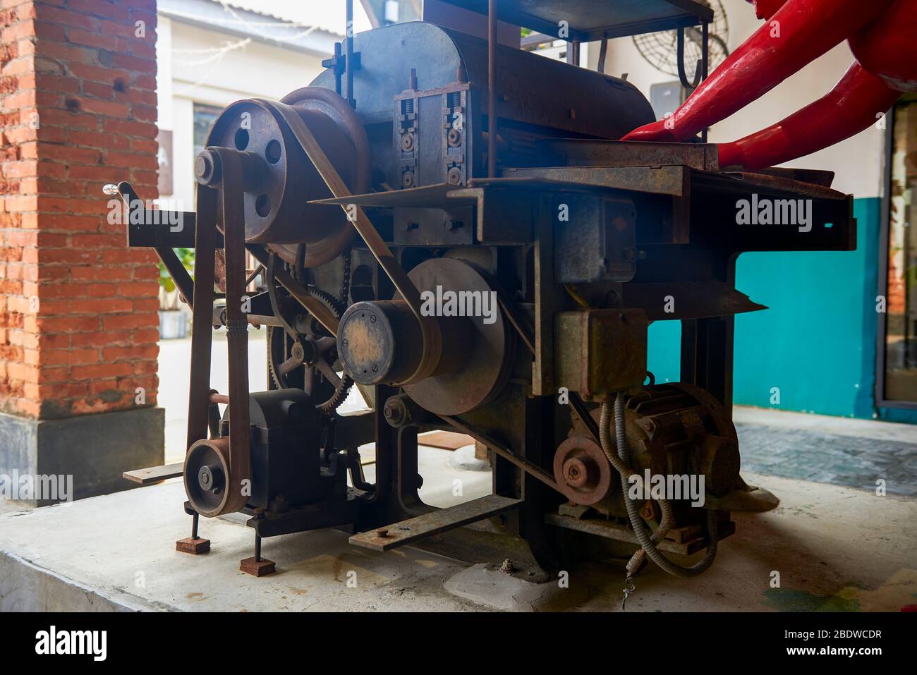 An old-fashioned industrial textile machine Stock Photo