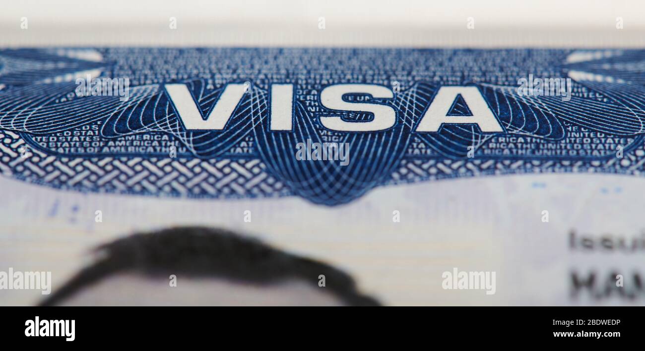 Macro of Usa visa stamp in passport. Travel to america theme Stock Photo