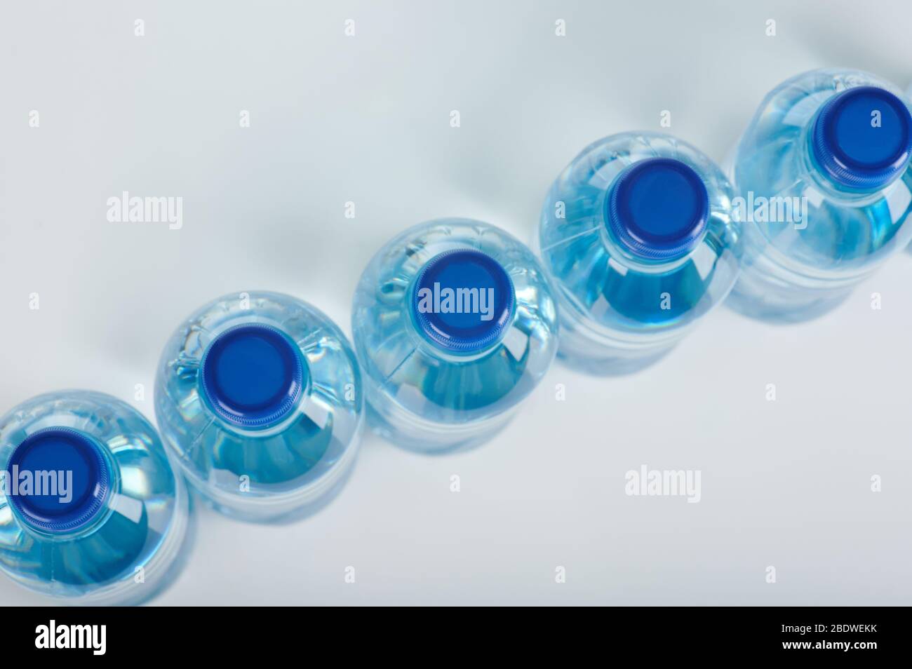 Blue plastic bottles above top view on diagonal Stock Photo
