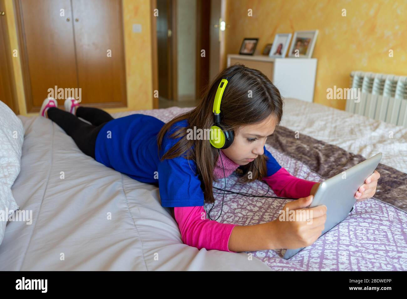 Preteen girl lying on bed hi-res stock photography and images - Alamy