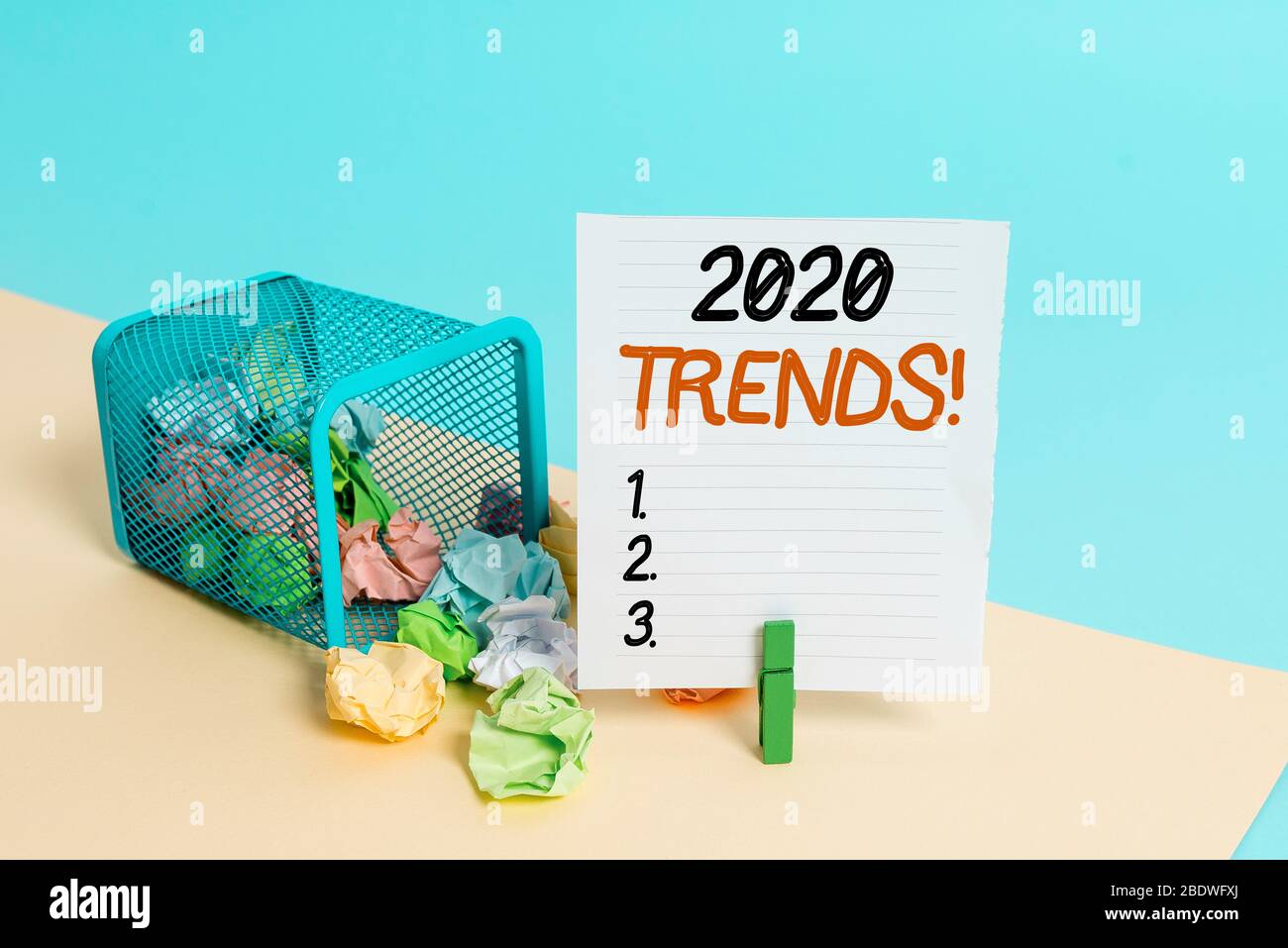 Conceptual hand writing showing 2020 Trends. Concept meaning general direction in which something is developing or changing Trash bin crumpled paper c Stock Photo