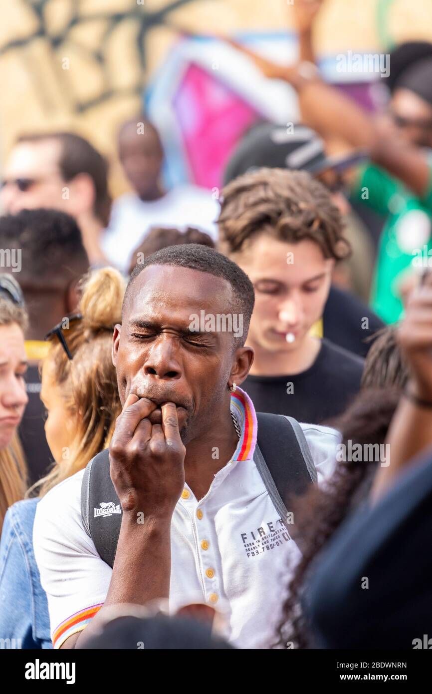 Portrait of a man whistling in a crowd at Notting Hill Carnival, London Stock Photo