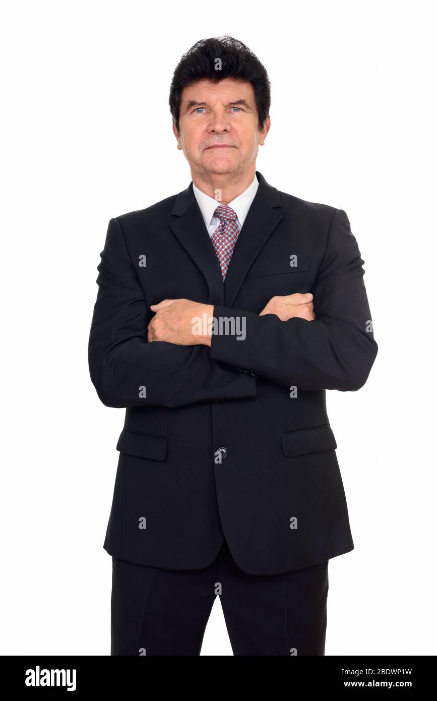 Portrait of mature handsome businessman in suit with arms crossed Stock ...