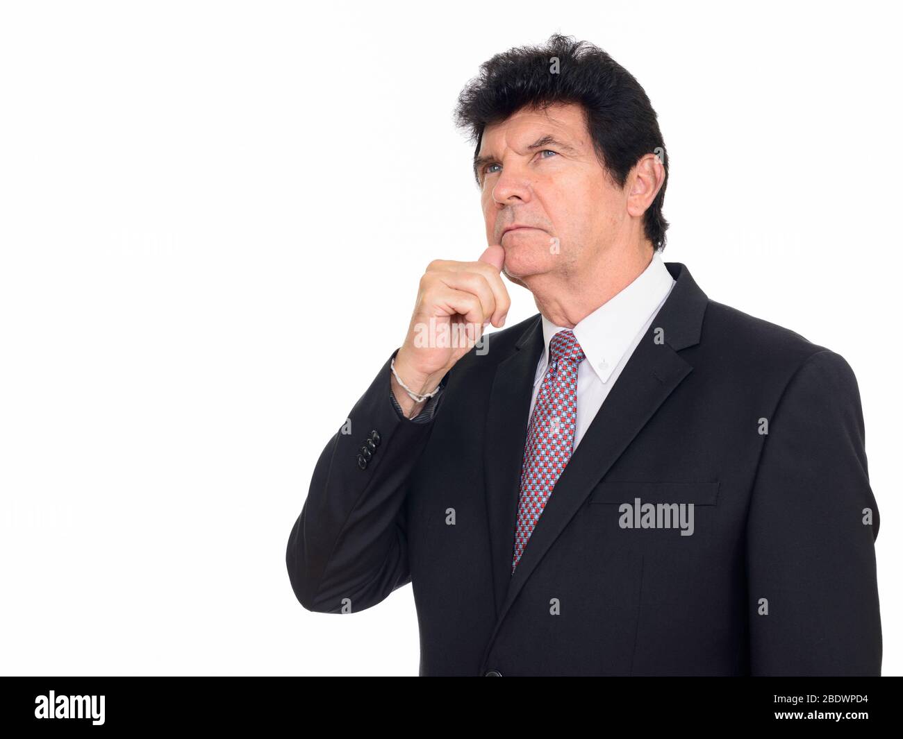 Portrait of mature handsome businessman in suit thinking Stock Photo ...