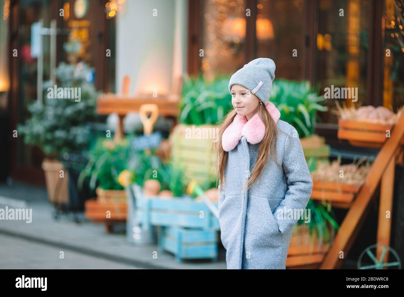 Adorable happy little girl outdoors in european city Stock Photo - Alamy