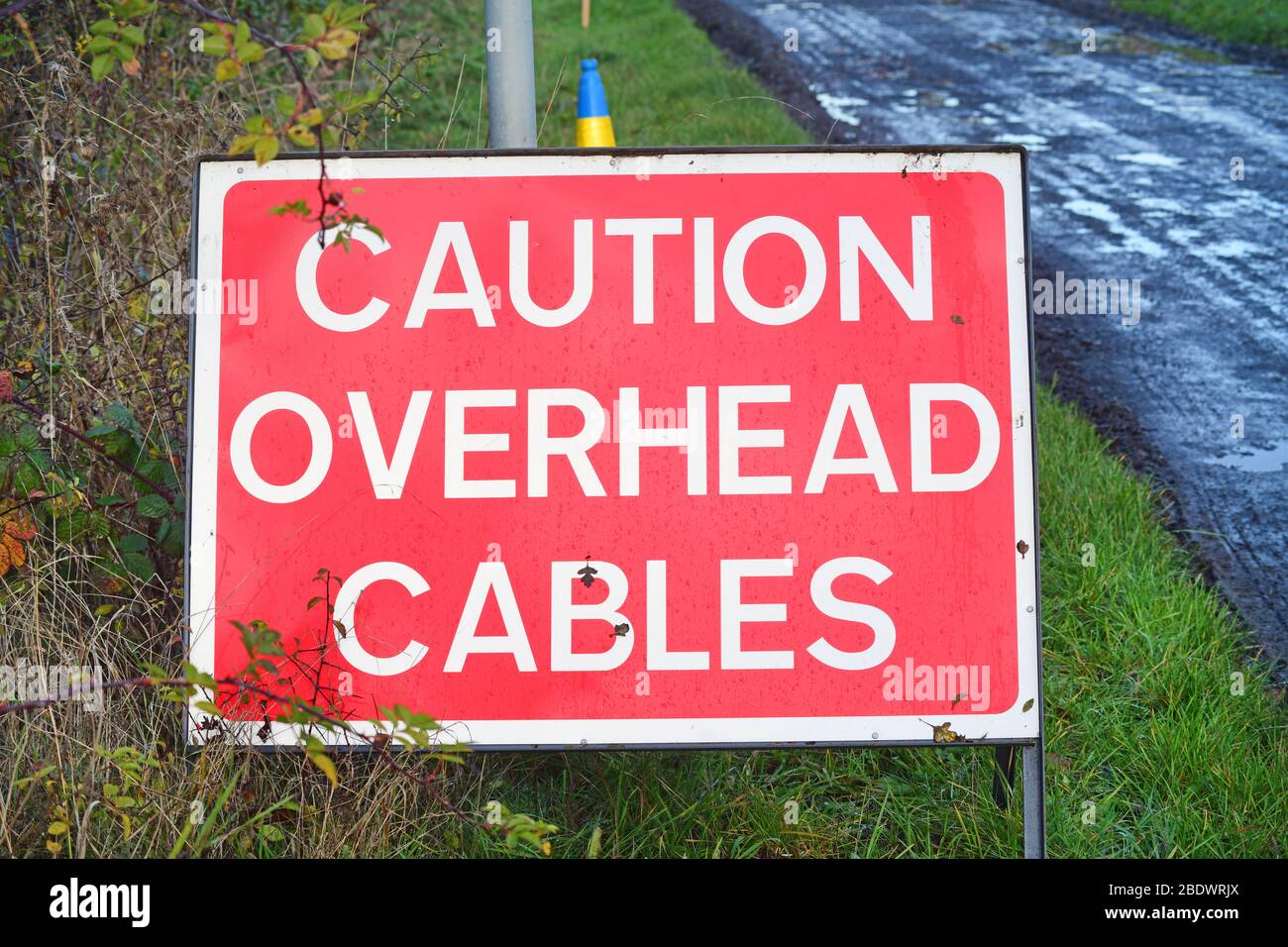 warning roadsign of overhead electricity cables at roadworks york yorkshire united kingdom Stock Photo