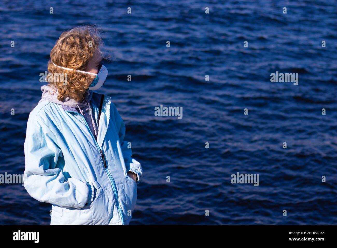 Woman wearing face mask side hi-res stock photography and images - Alamy