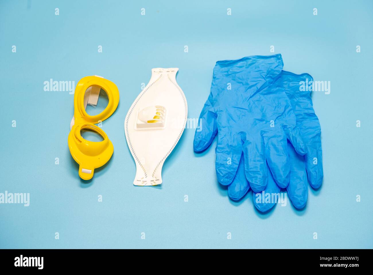 Medical mask, glasses and gloves mask on the background, protection against  coronavirus. Respiratory mask and latex gloves and goggles for the face  Stock Photo - Alamy
