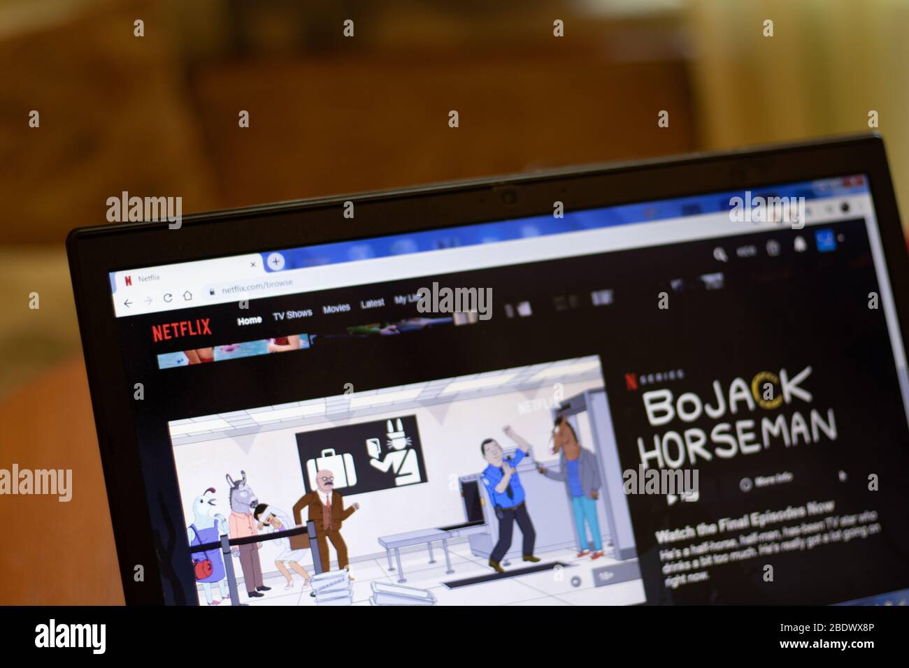 New York, USA - 9 April 2020: Netflix website on laptop screen close up. Man using service on display, blurry background, Illustrative Editorial Stock Photo