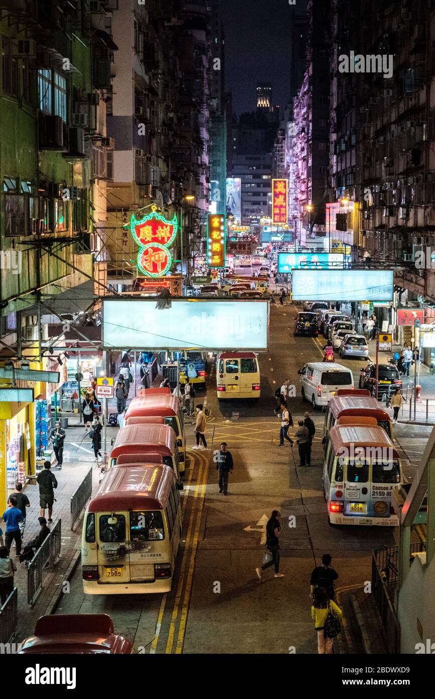 Hong Kong, November, 2019: Crowded street in Hong Kong at night at minibus bus station Stock Photo