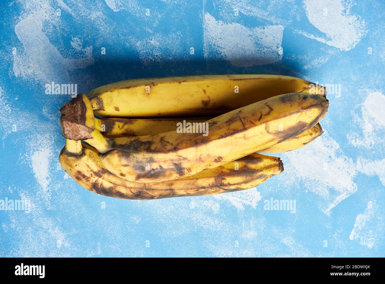 rotten bananas on a blue background. view from above Stock Photo Alamy