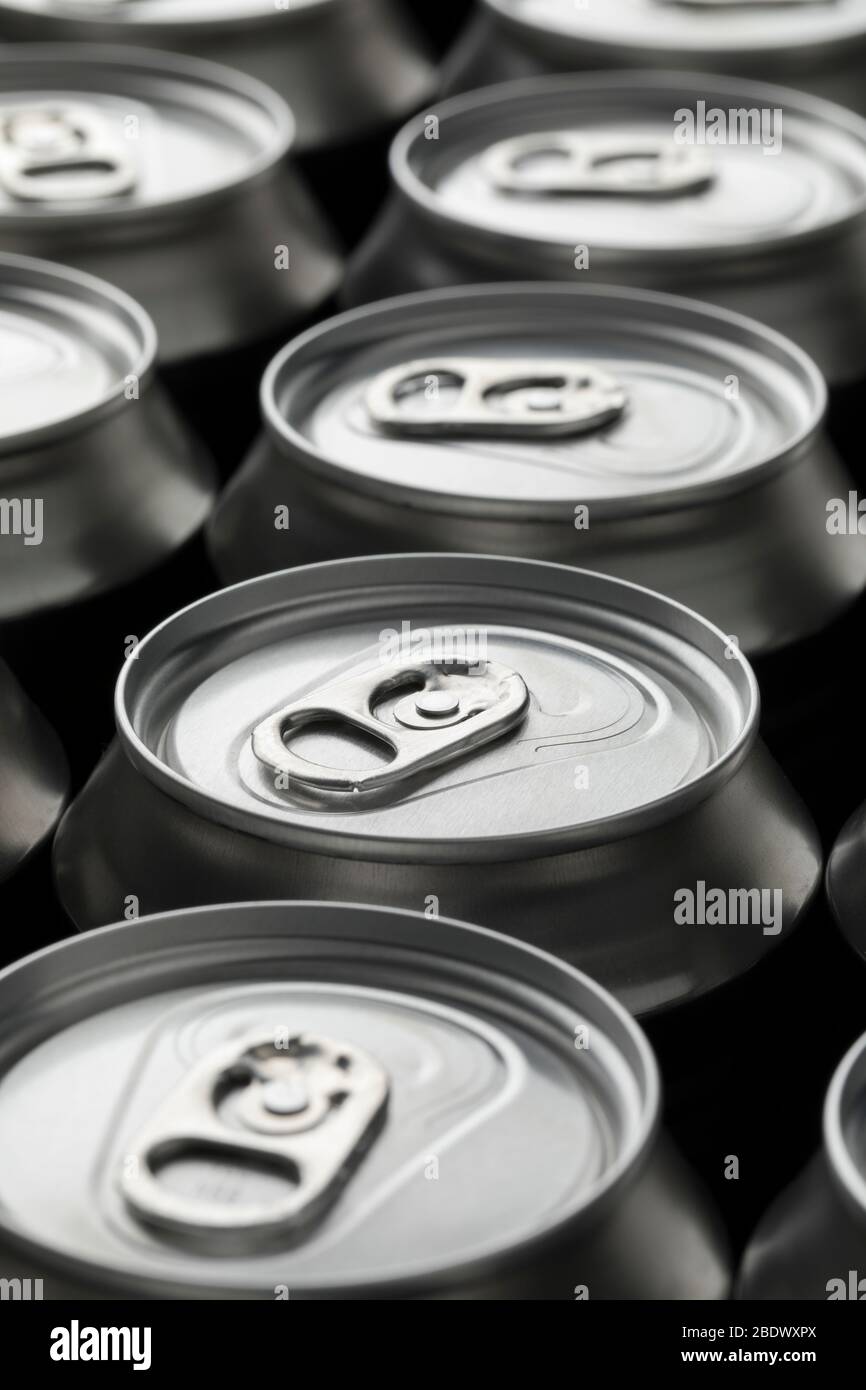 Row of unopened beer cans closeup full frame Stock Photo