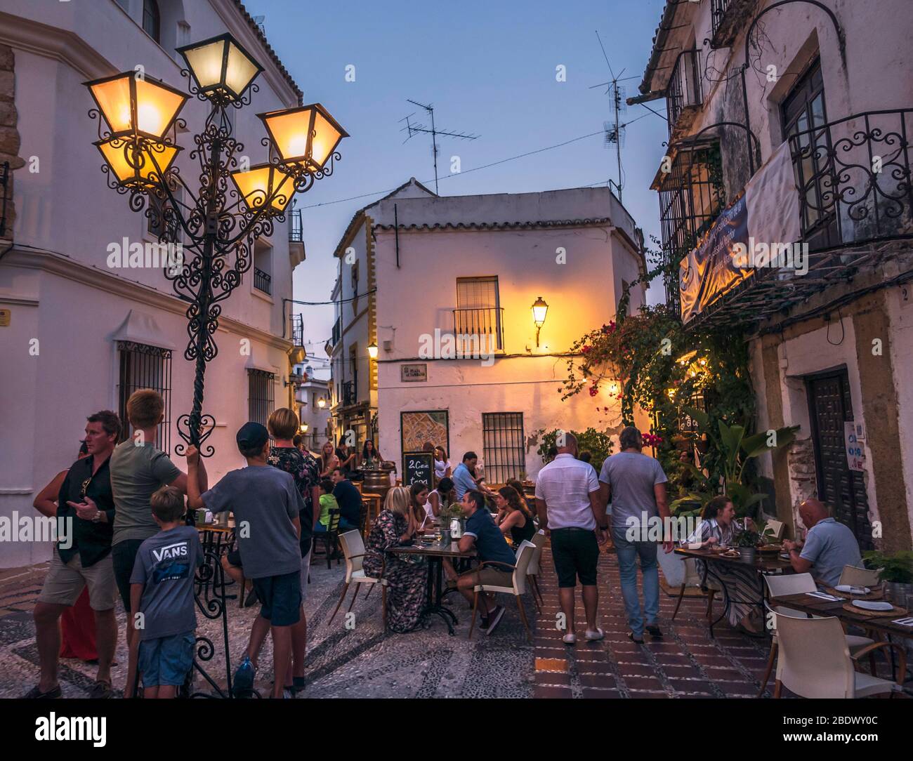 A busy narrow street in Marbella old town, Marbella, Spain. Stock Photo