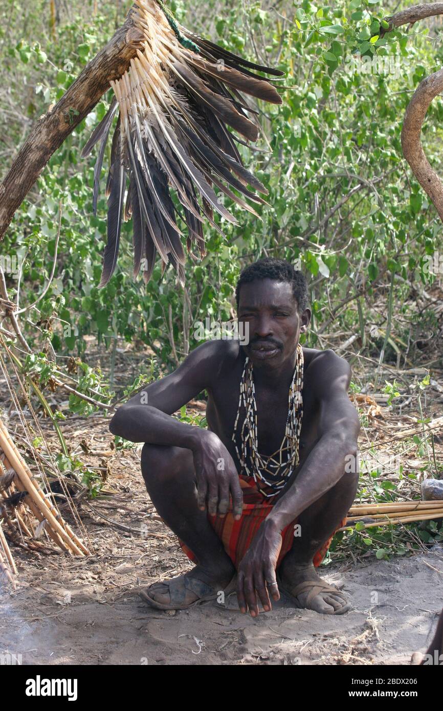 Hadza tribesman sitting Photographed at Lake Eyasi, Tanzania Stock Photo