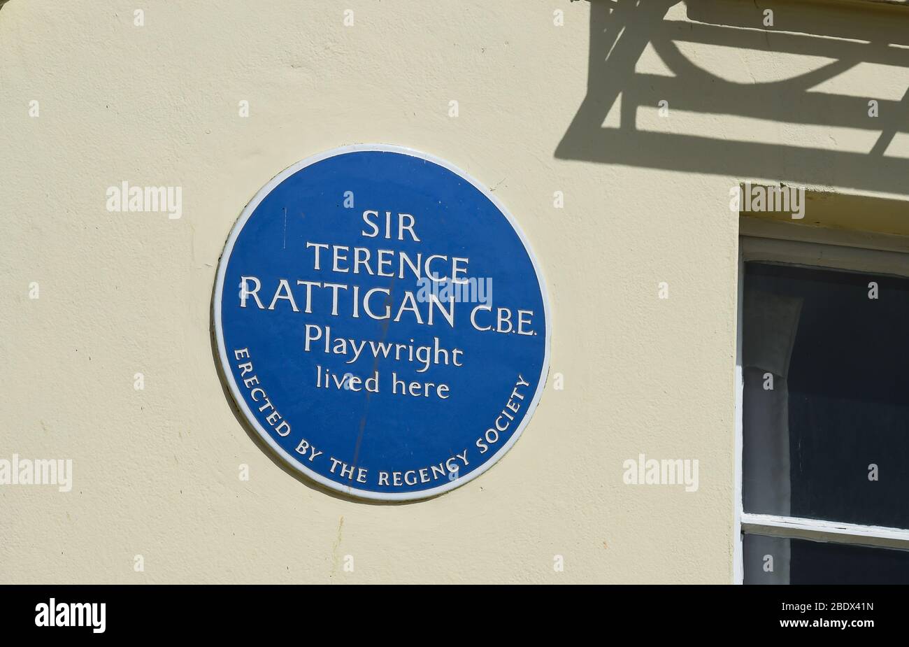 Blue plaque for Sir Terence Rattigan CBE who lived at 79 Marine Parade on the seafront at  Brighton UK erected by the local Regency Society Stock Photo